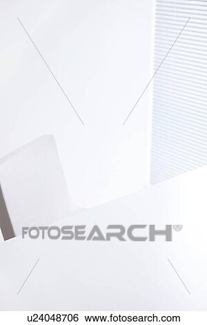 Stock Photograph - Desk and chair by window. Fotosearch