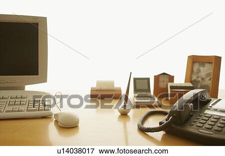 Stock Photo - Desk in office, white background. Fotosearch