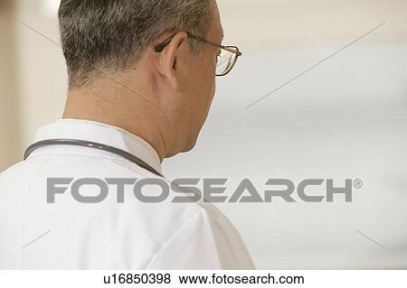 Doctor at corridor in hospital, differential focus View Large Photo Image Stock Photo - Doctor at corridor in hospital, differential focus. Fotosearch