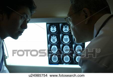 Picture - Doctors discussing X-rays. Fotosearch