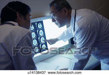 Stock Photo - Doctors discussing X-rays. Fotosearch