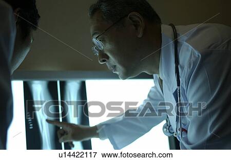 Stock Photo - Doctors discussing X-rays. Fotosearch