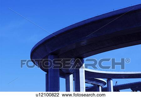 Stock Image - Elevated road against sky, blue background, Tokyo prefecture, Japan. Fotosearch