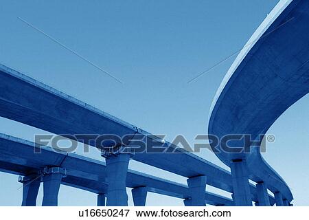 Stock Photo - Elevated road against sky, blue background, Tokyo prefecture, Japan. Fotosearch