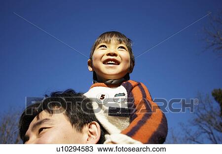 Father carrying son on shoulders, Tokyo Prefecture, Honshu, Japan View Large Photo Image Stock Image - Father carrying son on shoulders, Tokyo Prefecture, Honshu, Japan. Fotosearch