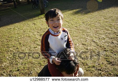 Father carrying son on shoulders, Tokyo Prefecture, Honshu, Japan View Large Photo Image Stock Photo - Father carrying son on shoulders, Tokyo Prefecture, Honshu, Japan. Fotosearch