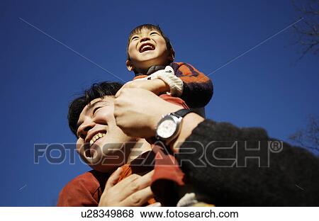 Father carrying son on shoulders, Tokyo Prefecture, Honshu, Japan View Large Photo Image Stock Photo - Father carrying son on shoulders, Tokyo Prefecture, Honshu, Japan. Fotosearch