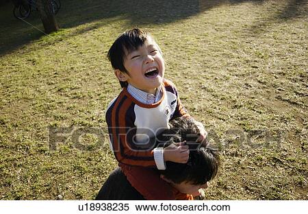 Father carrying son on shoulders, Tokyo Prefecture, Honshu, Japan View Large Photo Image Stock Photography - Father carrying son on shoulders, Tokyo Prefecture, Honshu, Japan. Fotosearch
