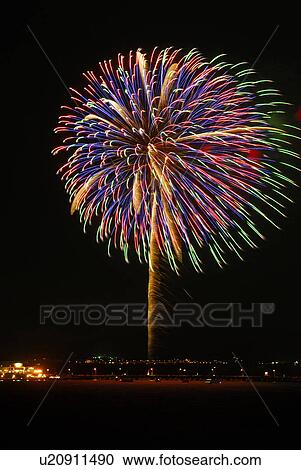Stock Image - Fireworks exploding in sky, black background, long exposure, Kamakura city, Kanagawa prefecture, Japan. Fotosearch