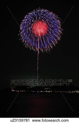 Stock Image - Fireworks exploding in sky, black background, long exposure, Kamakura city, Kanagawa prefecture, Japan. Fotosearch
