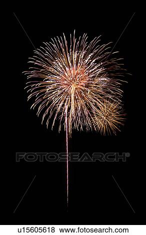 Stock Photo - Fireworks exploding in sky, black background, long exposure. Fotosearch
