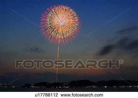 Stock Image - Fireworks exploding in sky, long exposure, Kamakura city, Kanagawa prefecture, Japan. Fotosearch