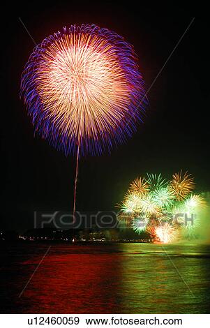 Stock Photo - Fireworks exploding in sky, long exposure, Kamakura city, Kanagawa prefecture, Japan. Fotosearch