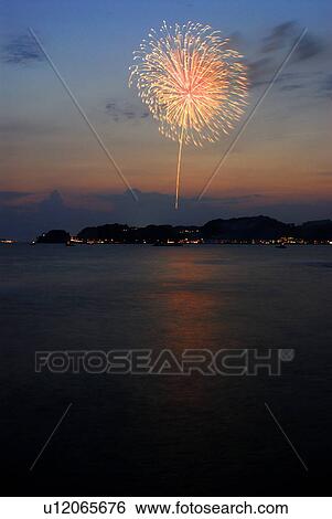 Stock Photograph - Fireworks exploding in sky, long exposure, Kamakura city, Kanagawa prefecture, Japan. Fotosearch