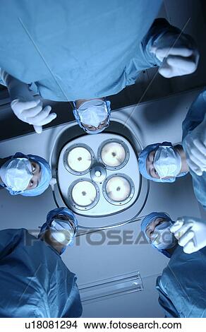 Five surgeons from operating table View Large Photo Image Picture - Five surgeons from operating table. Fotosearch