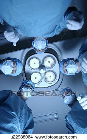 Five surgeons from operating table View Large Photo Image Picture - Five surgeons from operating table. Fotosearch