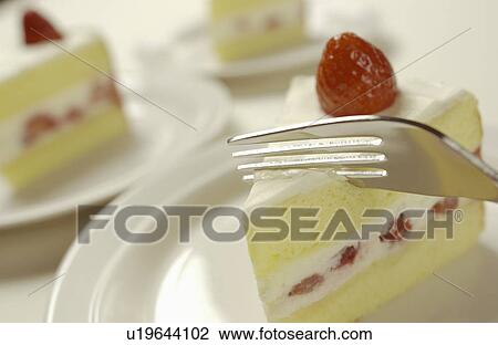 Fork on sliced strawberry cake, close up, white background View Large Photo Image Stock Image - Fork on sliced strawberry cake, close up, white background. Fotosearch