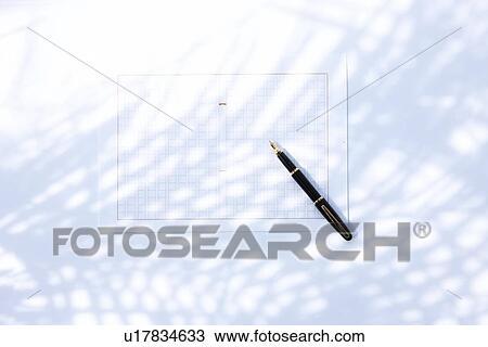Stock Image - Fountain pen on paper, white background. Fotosearch