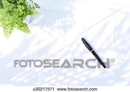Stock Image - Fountain pen on papers, white background. Fotosearch