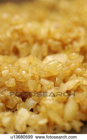 Stock Photo - Fried onion on pan, close up, full frame. Fotosearch