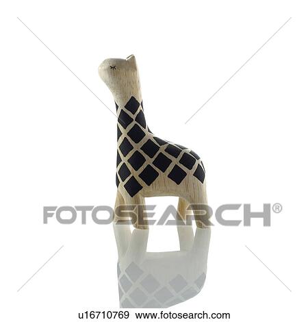 Stock Photo - Giraffe figurine on white background. Fotosearch