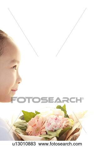 Girl holding a bouquet View Large Photo Image Stock Image - Girl holding a bouquet. Fotosearch