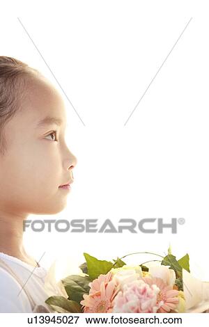 Stock Photo - Girl holding a bouquet. Fotosearch