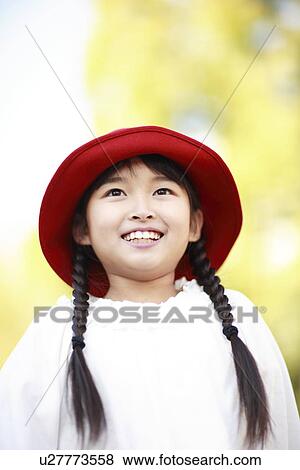 Girl with a red hat View Large Photo Image Stock Photo - Girl with a red hat. Fotosearch