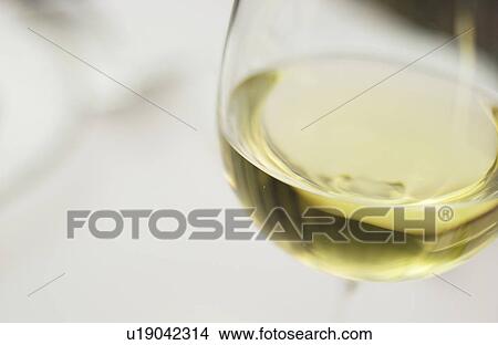 Picture - Glass of white wine, close up, differential focus. Fotosearch