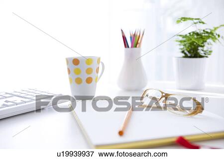 Glasses on note pad, close up View Large Photo Image Stock Photo - Glasses on note pad, close up. Fotosearch