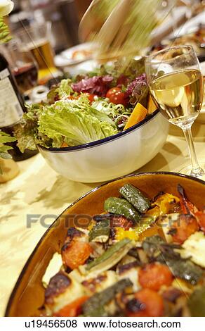 Stock Photo - Grilled vegetables and salad being served. Fotosearch