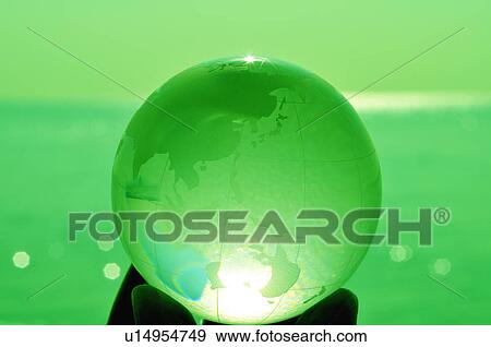 Stock Photo - Hand holding globe, close up, toned image, differential focus, Kamakura city, Kanagawa prefecture, Japan. Fotosearch
