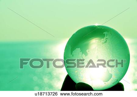 Hand holding globe, close up, toned image, differential focus, Kamakura city, Kanagawa prefecture, Japan View Large Photo Image Stock Photograph - Hand holding globe, close up, toned image, differential focus, Kamakura city, Kanagawa prefecture, Japan. Fotosearch
