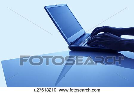 Hand using laptop, blue background View Large Photo Image Stock Image - Hand using laptop, blue background. Fotosearch