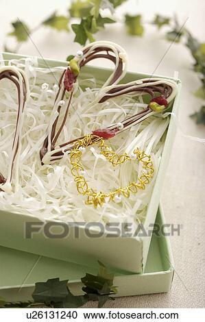 Stock Image - Heart Shaped Chocolate In Box. Fotosearch