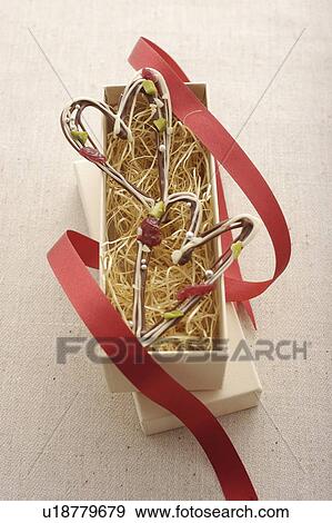 Stock Photo - Heart Shaped Chocolate In Box. Fotosearch