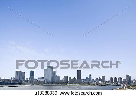 High rise buildings and Tokyo Bay under sky, copy space, Tokyo prefecture, Japan View Large Photo Image Stock Photo - High rise buildings and Tokyo Bay under sky, copy space, Tokyo prefecture, Japan. Fotosearch