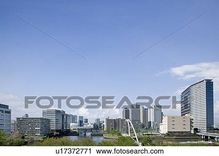 Stock Image - High rise buildings under sky, copy space, Tokyo prefecture, Japan. Fotosearch
