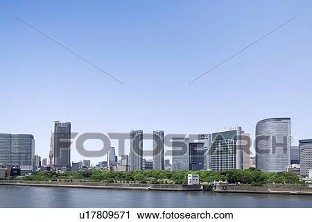 Stock Image - High rise buildings under sky, copy space, Tokyo prefecture, Japan. Fotosearch