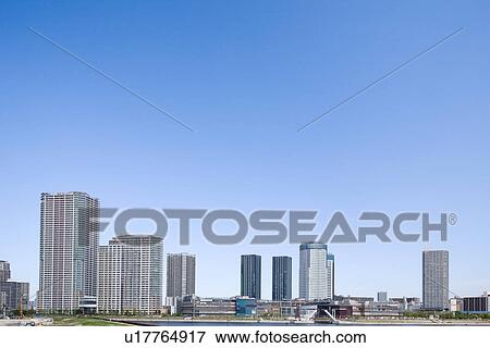 Stock Photo - High rise buildings under sky, copy space, Tokyo prefecture, Japan. Fotosearch