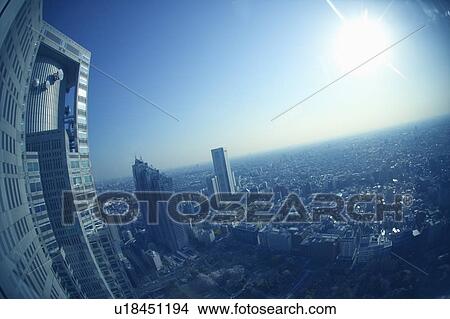 Picture - High rise buildings under sky, fish-eye lens, Tokyo prefecture, Japan. Fotosearch