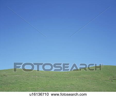 Stock Image - Hill and clear sky. Fotosearch
