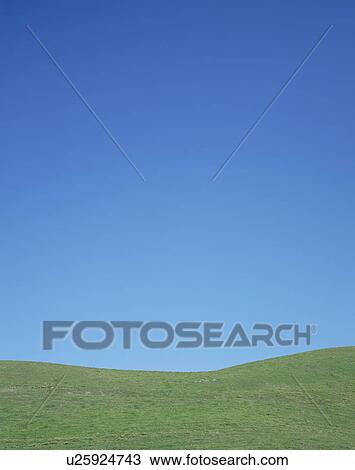Stock Image - Hill and clear sky. Fotosearch