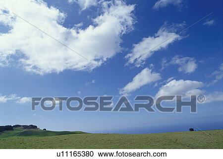 Stock Image - Hill and sky, Hawaii Islands, USA. Fotosearch