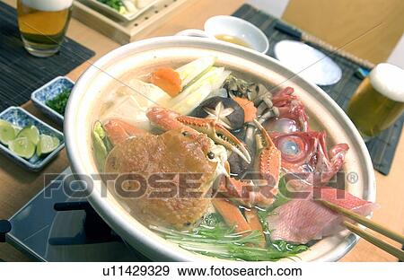 Stock Photo - Hot pot dish with crab and red sea bream. Fotosearch