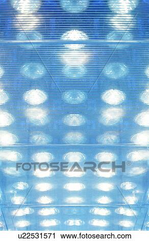 Stock Image - Illuminated windows, computer graphic, full frame. Fotosearch