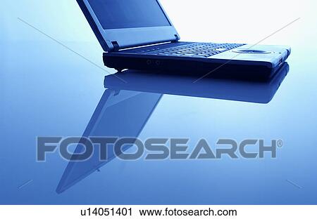 Laptop, blue background View Large Photo Image Stock Image - Laptop, blue background. Fotosearch