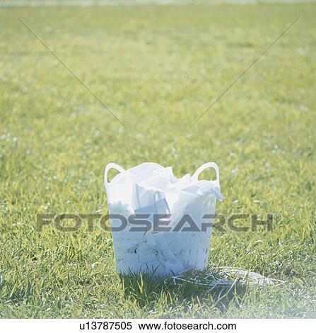 Laundry basket on lawn View Large Photo Image Stock Photography - Laundry basket on lawn. Fotosearch