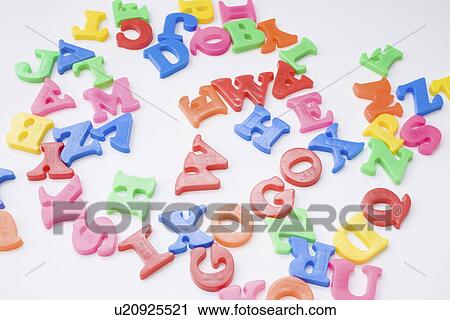 Stock Image - Letter magnets, white background. Fotosearch