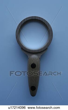 Magnifying glass, close up, blue background View Large Photo Image Stock Photograph - Magnifying glass, close up, blue background. Fotosearch